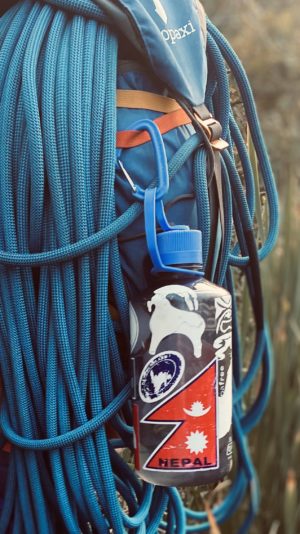 Narrow Mouth Water Bottle Attached to Hiking Backpack with a Carabeener