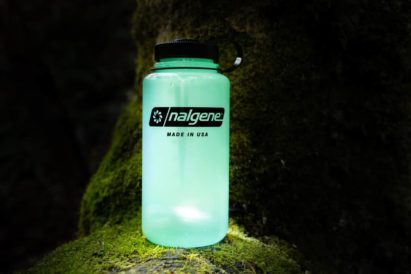 32 oz. Wide Mouth Bottle sitting atop a mossy rock