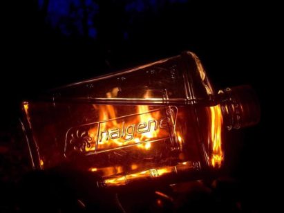 Campfire seen through clear Nalgene flask