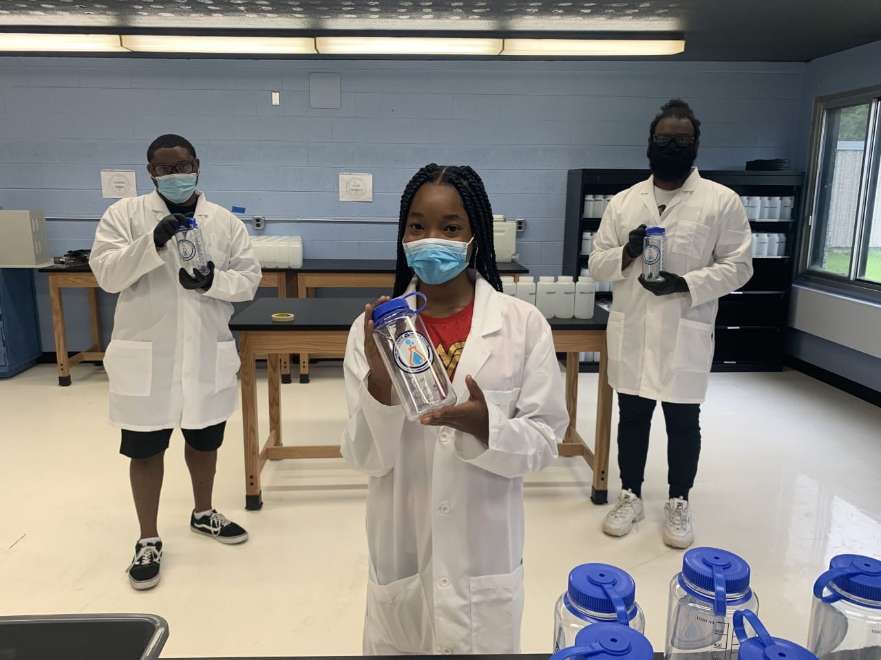 Thermofischer scientists in a lab making nalgene bottles