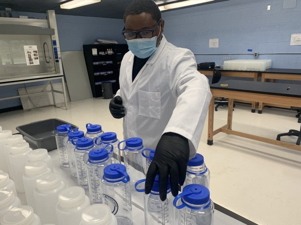Thermofischer scientists in a lab making nalgene bottles