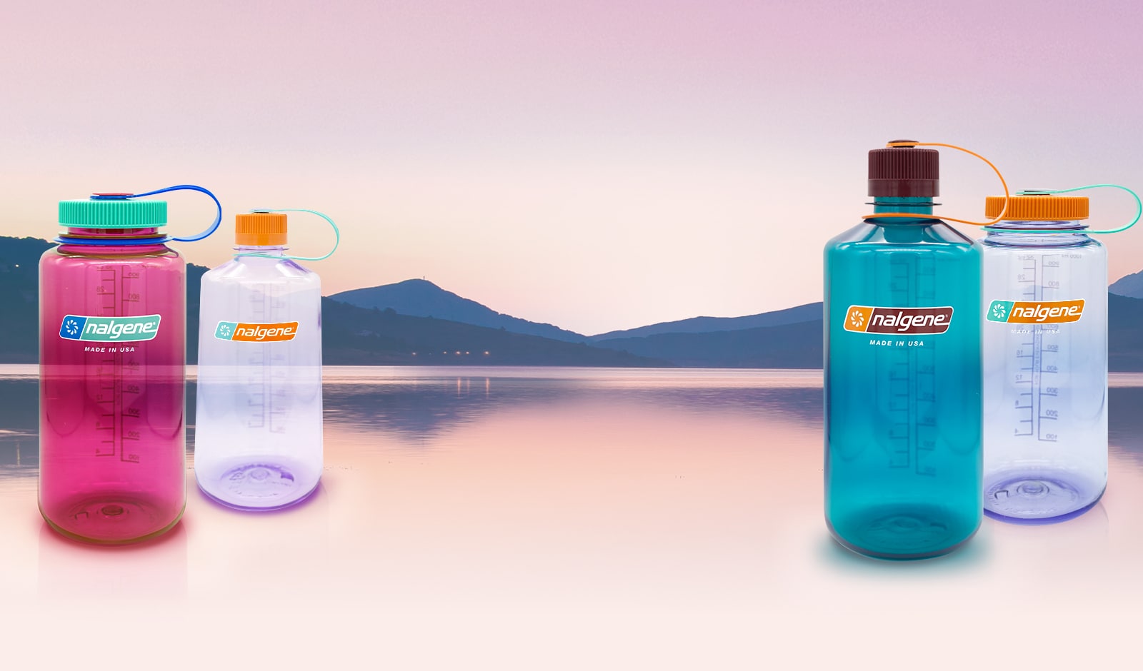 2021 New Colors Tritan Nalgene Bottles floating in front of a lake at sunset
