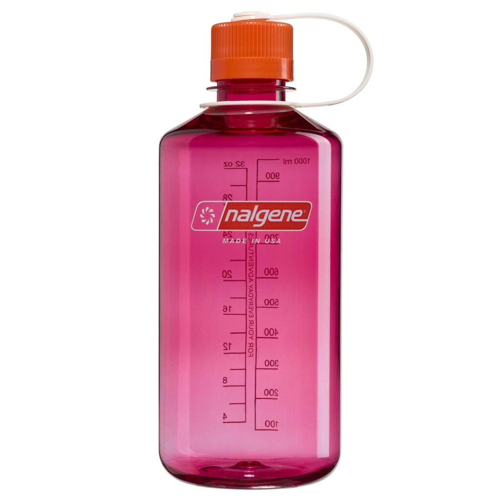 A pink Nalgene water bottle with measurement markings and an orange screw-top lid.