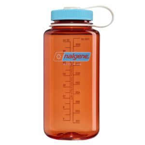 An orange Nalgene water bottle with a blue lid and volume markings, shown on a white background.