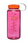 A pink Nalgene water bottle with an orange lid and white carrying loop, marked with measurement lines.