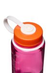 Close-up of a pink water bottle with an orange screw-on lid and a white carrying handle.